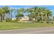 A community sign that reads 'Heritage Isles Golf and Country Club' along with lush landscaping and a vibrant, welcoming entrance at 10559 Coral Key Ave, Tampa, FL 33647