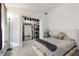 Bedroom with carpet and a bed that is next to a large closet with shelf space and decor at 11317 Fort King Rd, Dade City, FL 33525
