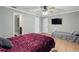 Large bedroom with an ensuite bathroom, two beds, and two closets, offering ample space at 11317 Fort King Rd, Dade City, FL 33525