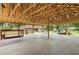 The structure offers ample work and storage space in a park-like setting at 11317 Fort King Rd, Dade City, FL 33525