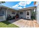 This backyard view showcases a wooden deck ideal for entertaining at 1144 Woodbrook Dr, Largo, FL 33770