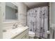 Bathroom featuring a decorative shower curtain and vanity at 1144 Woodbrook Dr, Largo, FL 33770