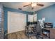 Bedroom with closet, wood-look flooring, ceiling fan, and desk at 1144 Woodbrook Dr, Largo, FL 33770