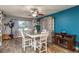 Bright dining area with a wooden table, hutch for display, and a cozy ambiance with a window view at 1144 Woodbrook Dr, Largo, FL 33770