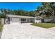 Picture of a charming single-story home featuring a manicured lawn and an inviting atmosphere at 1144 Woodbrook Dr, Largo, FL 33770