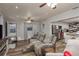 Cozy living room featuring wood-look floors, light gray walls and ceiling, and an open floorplan at 1144 Woodbrook Dr, Largo, FL 33770