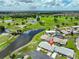 A stunning aerial view of the home's location near a beautiful lake and golf course at 1210 Eastloch Ct, Sun City Center, FL 33573
