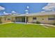 A large backyard with a manicured lawn, providing a tranquil outdoor space at 1210 Eastloch Ct, Sun City Center, FL 33573