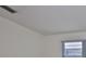 An empty bedroom featuring white walls, a window, and carpeted floors at 1210 Eastloch Ct, Sun City Center, FL 33573