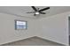 Bedroom with a window and ceiling fan at 1210 Eastloch Ct, Sun City Center, FL 33573