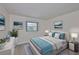 Tranquil bedroom featuring calming colors, a plush bed, and abundant natural light streaming in through the window at 1210 Eastloch Ct, Sun City Center, FL 33573