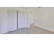 Bedroom with closet space, wood-look flooring and white trim at 1210 Eastloch Ct, Sun City Center, FL 33573