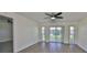 Bedroom featuring new flooring and sliding glass doors to the outside at 1210 Eastloch Ct, Sun City Center, FL 33573