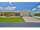Charming single-story home with a well-manicured lawn and inviting curb appeal at 1210 Eastloch Ct, Sun City Center, FL 33573