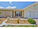 Close-up view of the home's front facade with beautiful stone accents and landscaping at 1210 Eastloch Ct, Sun City Center, FL 33573