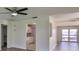 Bright kitchen featuring white cabinets and appliances, with an open layout offering easy access to other living areas at 1210 Eastloch Ct, Sun City Center, FL 33573