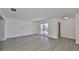Living room featuring new flooring and exterior view at 1210 Eastloch Ct, Sun City Center, FL 33573