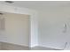 Open living room with wood-look flooring, and view to front yard at 1210 Eastloch Ct, Sun City Center, FL 33573