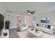 Inviting living room featuring contemporary furnishings, a plush white rug, and an open layout that flows into the kitchen at 1210 Eastloch Ct, Sun City Center, FL 33573