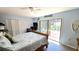 Light-filled bedroom with access to the screened lanai, providing seamless indoor-outdoor living at 13 Windrush Bay Dr, Tarpon Springs, FL 34689