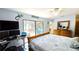 Bedroom overlooking the screened patio and outdoor living space with a dedicated desk and computer at 13 Windrush Bay Dr, Tarpon Springs, FL 34689