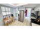Bright kitchen with stainless steel refrigerator, tile flooring, and breakfast table at 13 Windrush Bay Dr, Tarpon Springs, FL 34689