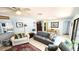 Inviting living room with a cozy atmosphere, neutral palette, and access to a dining area at 13 Windrush Bay Dr, Tarpon Springs, FL 34689