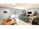 Open living and dining area features tile flooring, patio access, and comfortable seating at 13 Windrush Bay Dr, Tarpon Springs, FL 34689