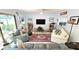 Comfortable living room area with modern decor, tile floors, and lots of space at 13 Windrush Bay Dr, Tarpon Springs, FL 34689