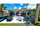 Outdoor patio area with comfortable seating and access to water views at 13 Windrush Bay Dr, Tarpon Springs, FL 34689