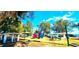 Gathering-friendly park with playground, featuring colorful play structures and shaded picnic areas at 13 Windrush Bay Dr, Tarpon Springs, FL 34689