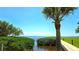 Waterfront view with palm tree and water view at 13 Windrush Bay Dr, Tarpon Springs, FL 34689