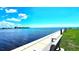 Scenic view of the water from the community's waterfront park with benches at 13 Windrush Bay Dr, Tarpon Springs, FL 34689