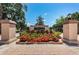 Aberdeen gated community entrance features manicured landscaping and a welcoming brick paved entrance on a beautiful day at 1303 Forestedge Blvd, Oldsmar, FL 34677
