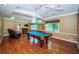 Entertaining game room complete with a pool table, recessed lighting, and hardwood flooring at 1303 Forestedge Blvd, Oldsmar, FL 34677