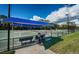 Well-maintained tennis courts on a sunny day at 1303 Forestedge Blvd, Oldsmar, FL 34677