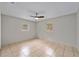 Bedroom with tile flooring, ceiling fan, and windows for natural light at 1309 11Th W Ave, Palmetto, FL 34221