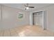 Comfortable bedroom with tile flooring and closet storage at 1309 11Th W Ave, Palmetto, FL 34221