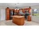 Well-equipped kitchen featuring granite countertops, an island, and stainless steel appliances at 1309 11Th W Ave, Palmetto, FL 34221
