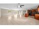 Open floor plan featuring tile flooring, a kitchen island, sliding barn doors, and lots of natural light at 1309 11Th W Ave, Palmetto, FL 34221