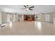 Spacious, open living space featuring tile flooring, ceiling fans, and abundant natural light at 1309 11Th W Ave, Palmetto, FL 34221