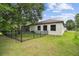 Well-maintained backyard with a screened-in patio and black aluminum fence at 13503 Gopher Pond Ct, Hudson, FL 34669