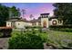 Charming home featuring unique tower, arched windows, and well-manicured landscaping at 13503 Gopher Pond Ct, Hudson, FL 34669