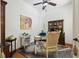 Cozy office featuring a ceiling fan, unique artwork, and a comfortable chair at 13503 Gopher Pond Ct, Hudson, FL 34669