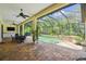 Inviting screened-in pool and spa area with covered patio, ideal for relaxing or entertaining at 13503 Gopher Pond Ct, Hudson, FL 34669