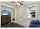 Bedroom with closet, ceiling fan, wood floors and bright window at 1359 S Michigan Ave, Clearwater, FL 33756
