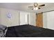 A primary bedroom with a ceiling fan, and a stylish barn door closet at 1359 S Michigan Ave, Clearwater, FL 33756