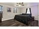 Inviting bedroom featuring wood-look floors, ceiling fan, and a neutral color scheme at 1359 S Michigan Ave, Clearwater, FL 33756