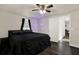 Well-lit bedroom featuring a dark-wood floor, ceiling fan, and stylish interior design at 1359 S Michigan Ave, Clearwater, FL 33756