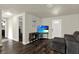 Cozy living room with a comfortable sofa, entertainment center and direct access to the entrance door at 1359 S Michigan Ave, Clearwater, FL 33756